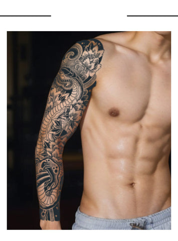 Man with a detailed sleeve tattoo on his arm against a dark background