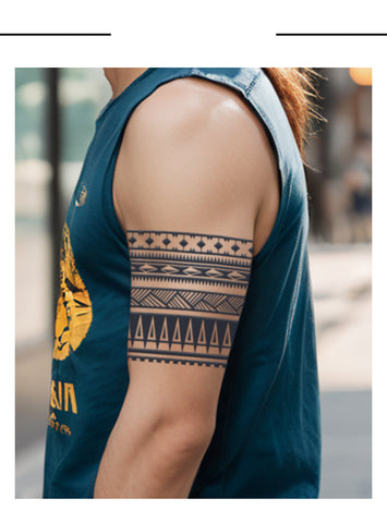 Person wearing a sleeveless denim shirt with a geometric arm tattoo.