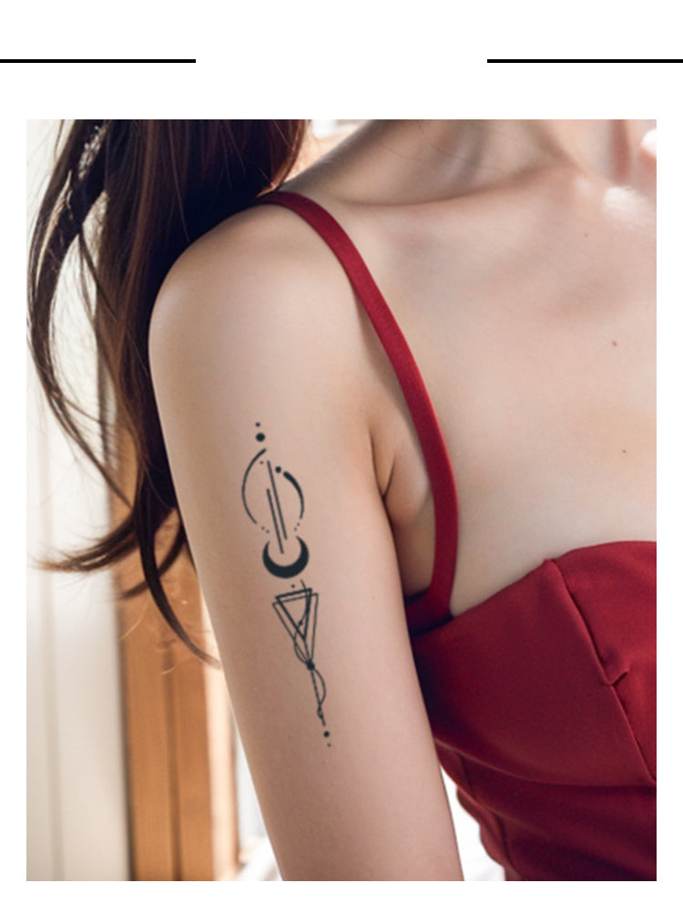Person wearing a red top with a black arm tattoo on a blurred background